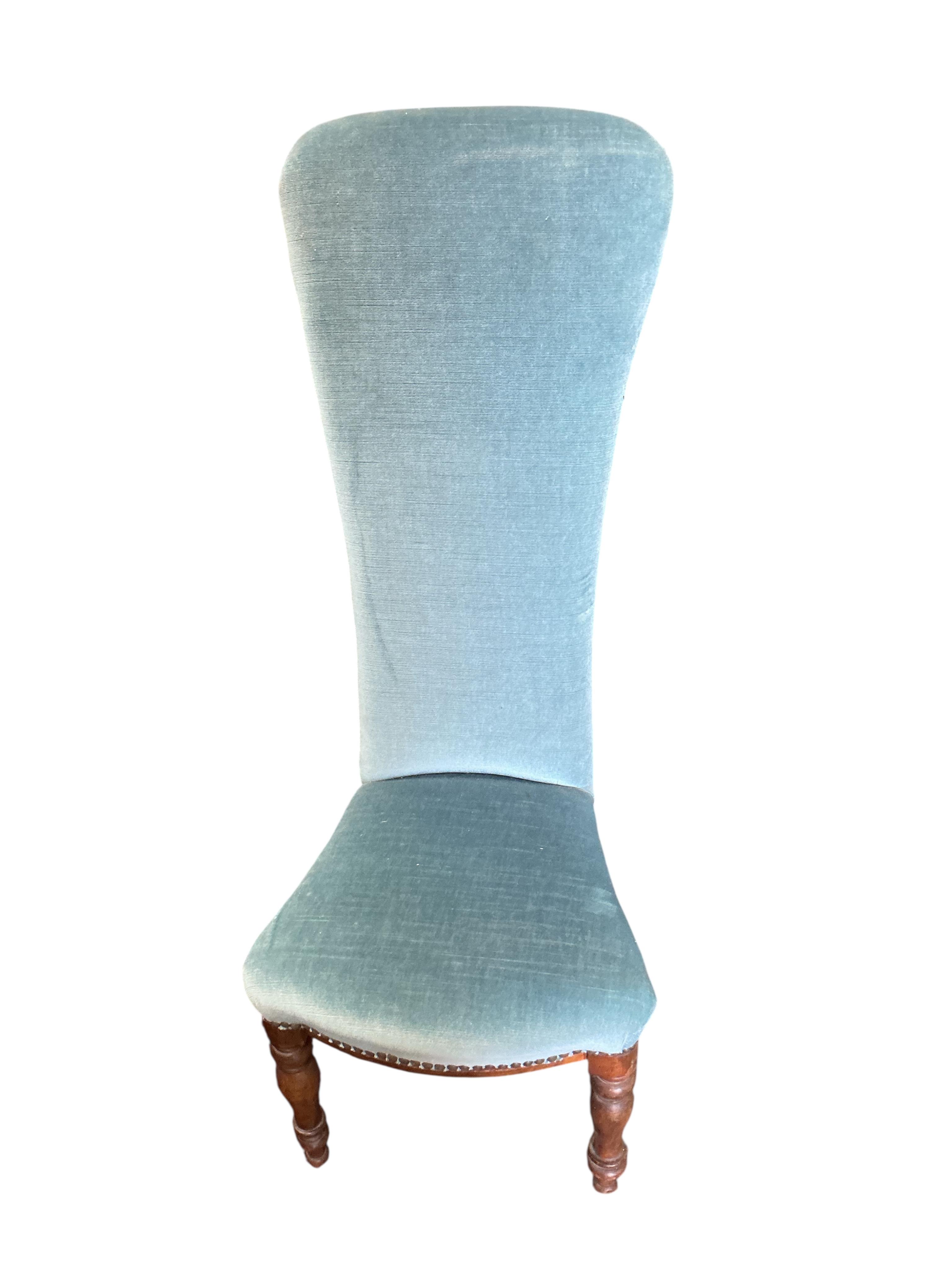 A Victorian upholstered mahogany nursing chair together with a Victorian prie dieu chair